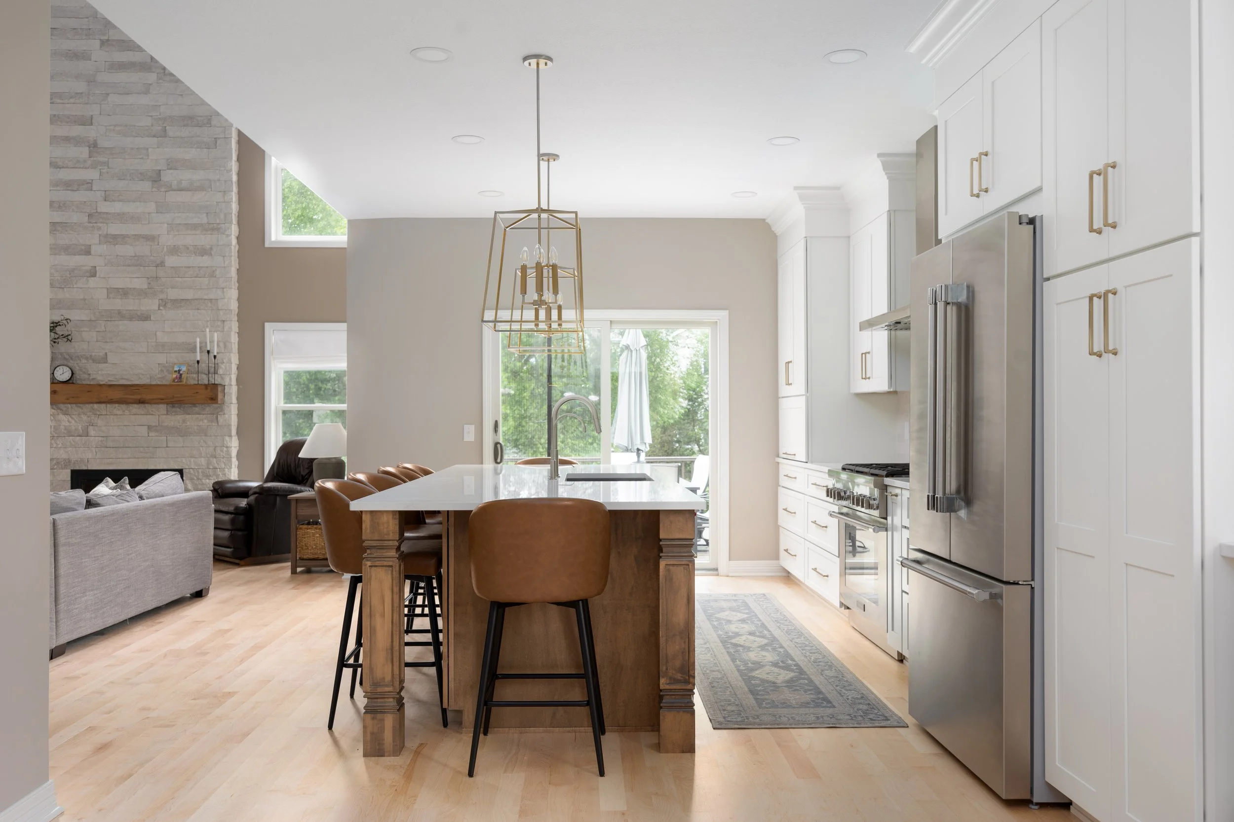 Finished Mik Homes kitchen with an island and pendant lighting