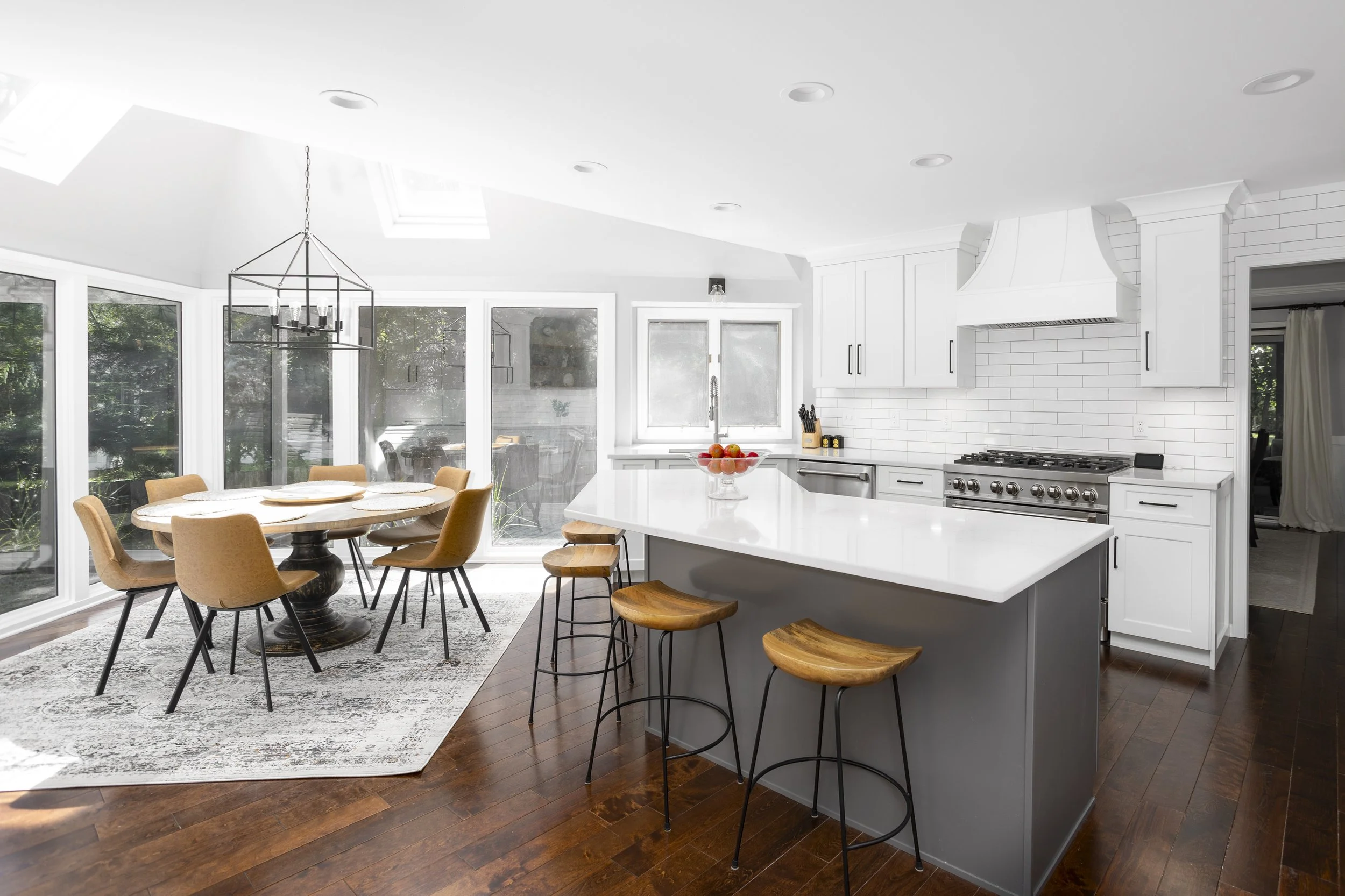 Mik Homes kitchen with custom cabinetry and stone countertops
